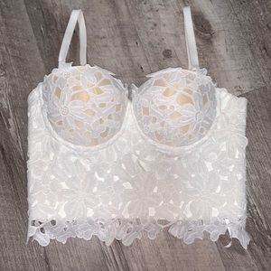 White strapless shirt. Comes with removable straps.